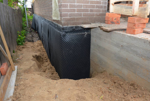 SJ Waterproofing Pros technician performing targeted Wet Basement Repair assessment in Snellville, GA